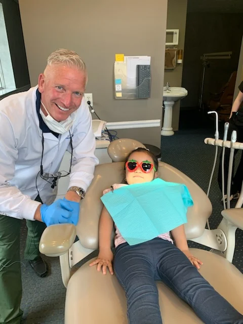 Dr. Benham with a happy patient